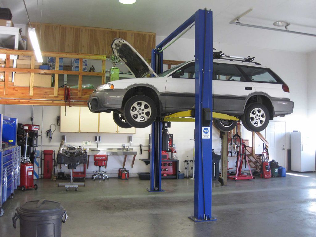 Subaru on lift in auto shop